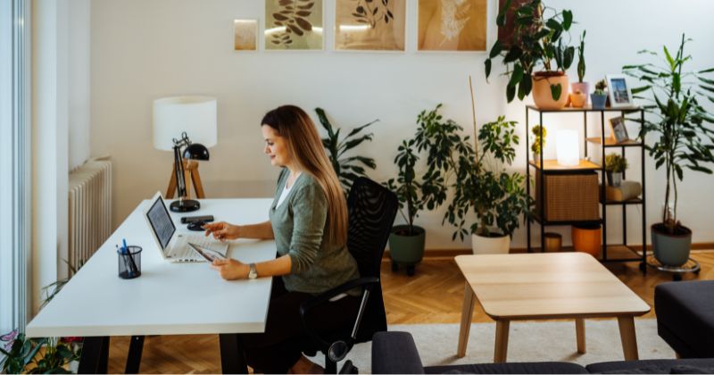 Woman working in her home office space with a comfortable temperature