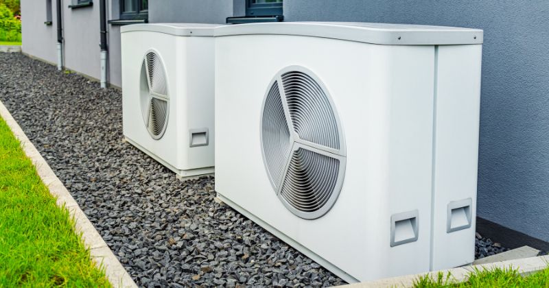 Installed air source heat pumps outside a house.