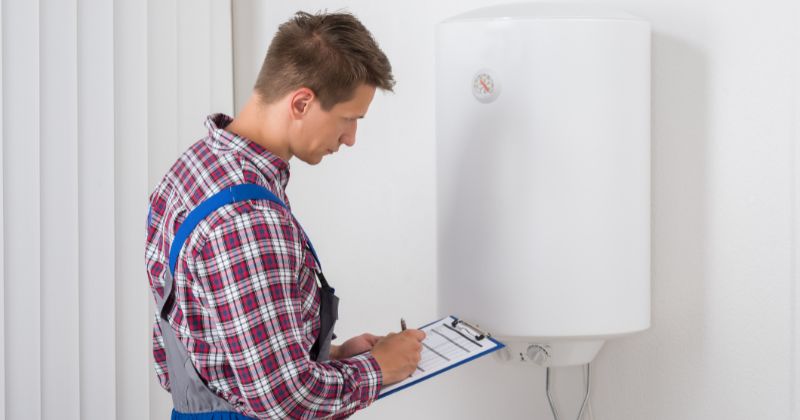 man checking an electric boiler