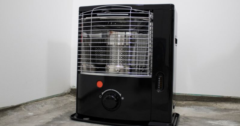 A kerosene heater placed to the side.