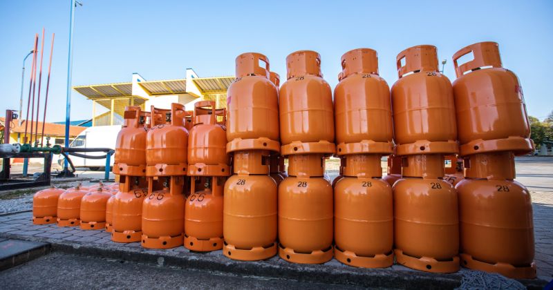 Several LPG Orange Tanks stacked together.