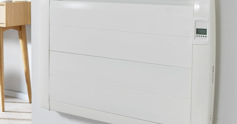 A white slimline digital energy-efficient electric radiator wall-mounted.