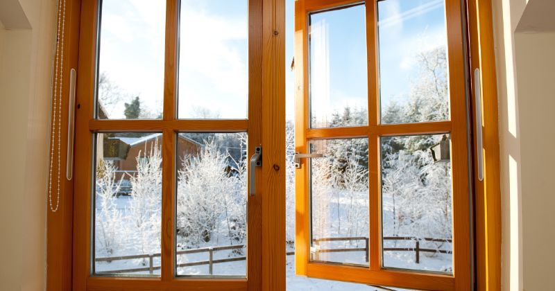 Clean and well-wiped wooden window frames to let in sunlight during the winter season.