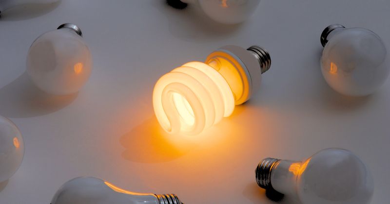 Several energy-saving bulbs placed on a white table.