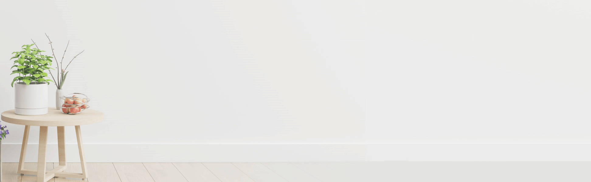 a plain white background with side table and a plant