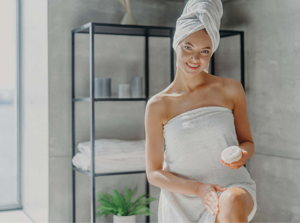 A woman taking a bath wrapped herself in a white towel.