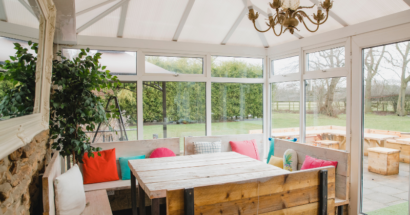 Conservatory room with elegant casement windows.