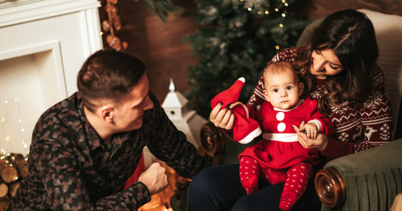 Family of three enjoying warmth during Christmas