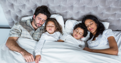 Family sleeping peacefully in bedroom with ideal temperature