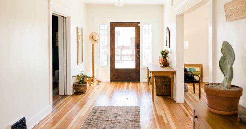 Open-air corridor with textured brown paint.