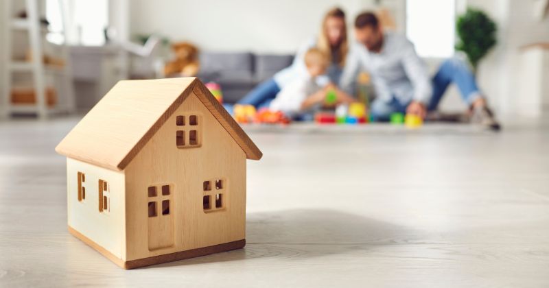 Family in cosy living room, warmed by installed electric radiator.