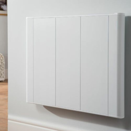 Slimline white wall-mounted electric radiator in home.